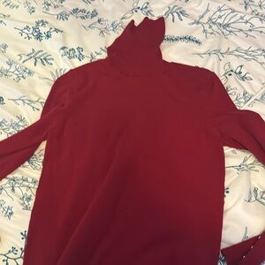 Sweater with gold buttons on the sleeve, red wine colored
